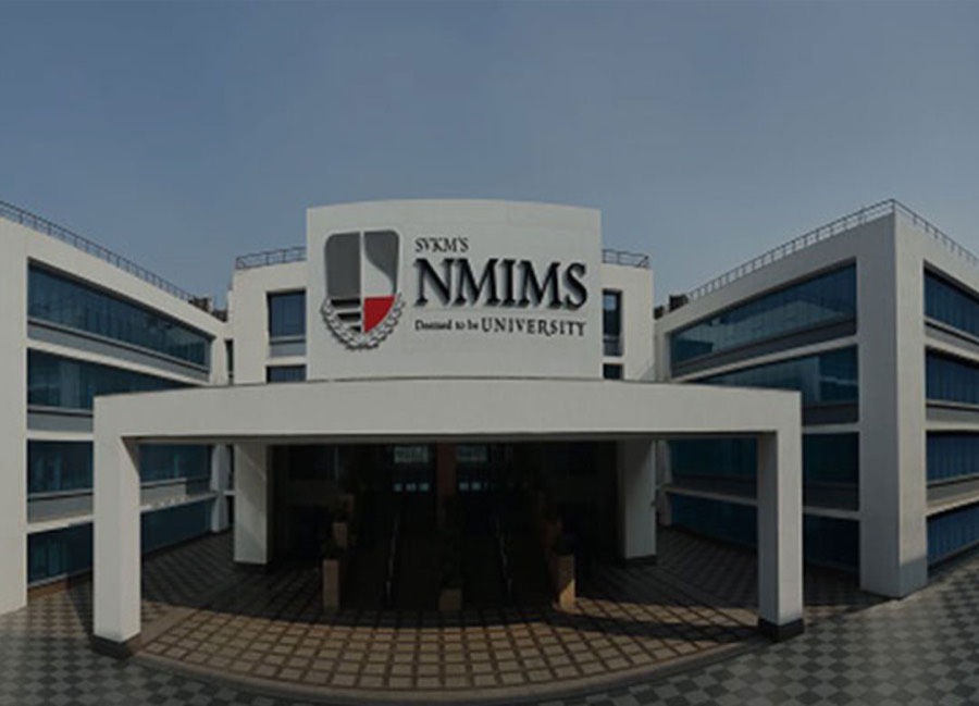 SVKM's NMIMS at Vile Parle West, Mumbai — the white academic building carrying the NMIMS signage above its entrance